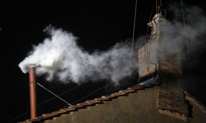 White smoke emerges from the chimney on roof of the Sistine Chapel to signify there is a new pope